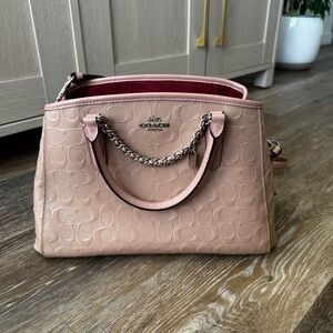 Pink embossed coach bag